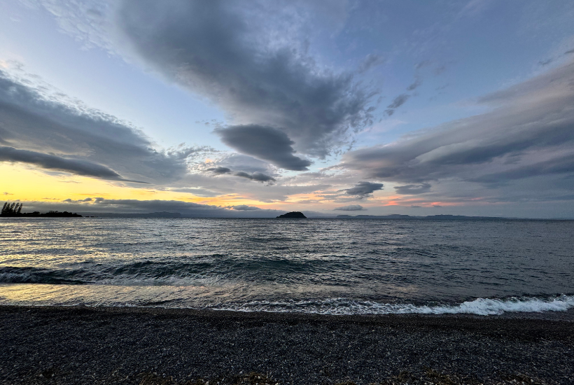 Motutere Bay campsite with views of the lake at sunset