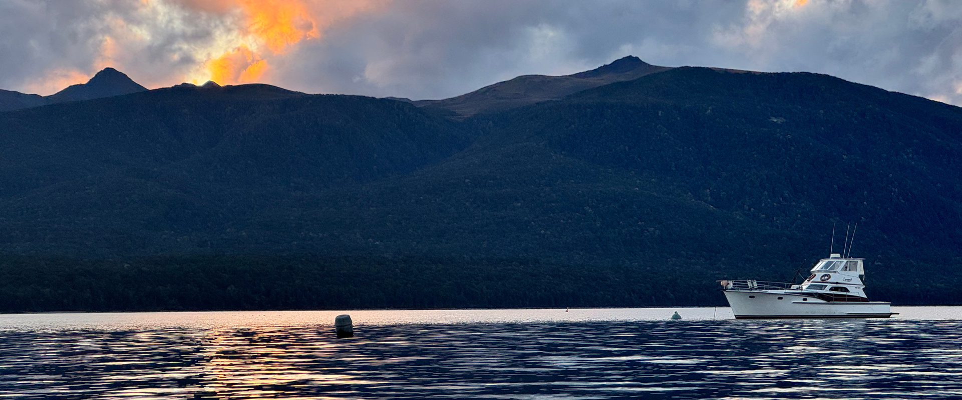 Lake during sunset with a boat on the water